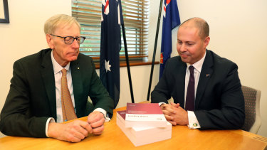 There wasn't a lot of conversation when banking royal commissioner Kenneth Hayne (left) delivered his final report to Treasurer Josh Frydenberg. "A handshake or something ...?" implored a photographer.