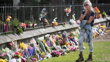 Floral tributes on the fence of the Christchurch Botanic Gardens on Saturday.