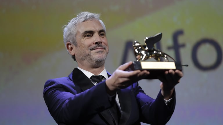 Alfonso Cuaron with his Golden Lion Best Film award for Roma, in Venice.