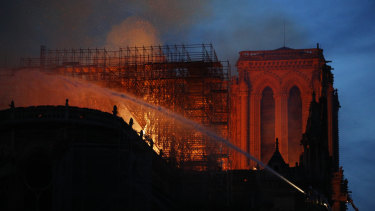 Firefighters use hoses as Notre-Dame Cathedral burns in Paris.