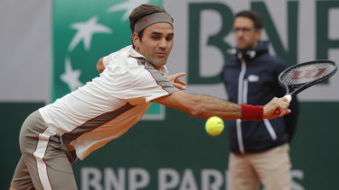 Breaking point: Roger Federer at full stretch during the semi-final against Rafael Nadal.