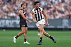 Scott Pendlebury of the Magpies celebrates kicking a goal.