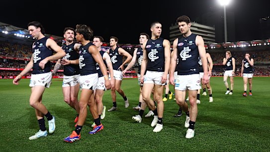 A disappointed and disappointing Carlton leave the ground after being eliminated from finals