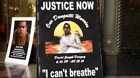Banners reading "Justice for David Dungay" outside the Downing Centre Court in Sydney. He died in custody in 2015. 
