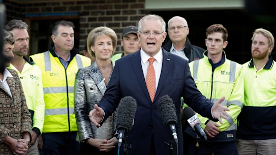 Minister Michaelia Cash and Prime Minister Scott Morrison with tradies in April 2019.