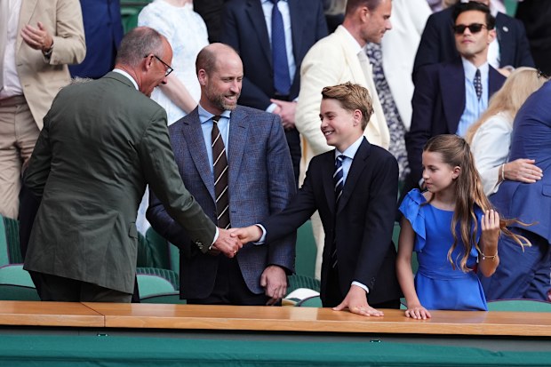 German Chancellor Friedrich Merz, left, greets Prince William, Prince George and Princess Charlotte at the 2026 Wimbledon Tennis Championships at the All England Lawn Tennis and Croquet Club on July 12, 2026 in London, England.