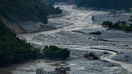 Destroyed buildings can be seen where part of Betrawoti township has been submerged or swept away by the Nepal flood disaster on the Trishuli River. 