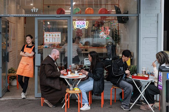 Joris Zhao (standing) opened the shop with her retired parents.