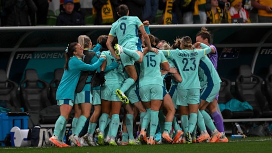 The Matildas celebrate their fourth goal against Canada.