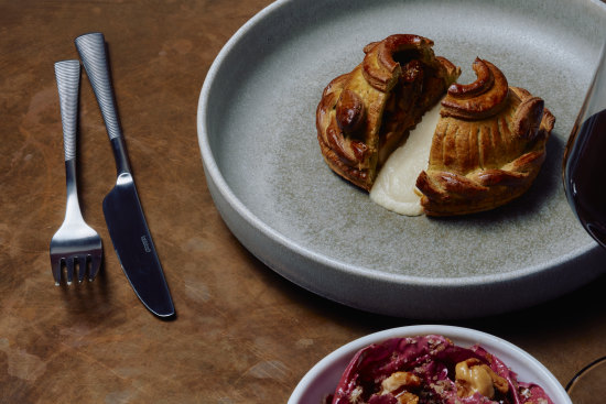 Celeriac pithivier with onion and stout gravy poured tableside.⁠