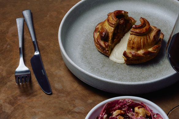 Celeriac pithivier with onion and stout gravy poured tableside.⁠