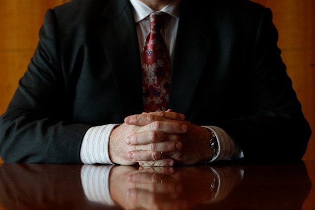 Generic job interview photo showing a boss' hands.