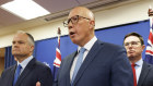Opposition Leader Peter Dutton flanked by shadow energy spokesman Ted O’Brien (left) and Nationals leader David Littleproud in Brisbane on Friday.