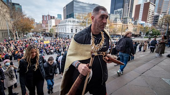 Yoorrook commissioner Travis Lovett leading the truth walk to the steps of parliament on June 16.