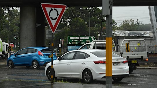 Traffic moves through the roundabout at Homebush Bay Drive and Australia Avenue at Sydney Olympic Park.