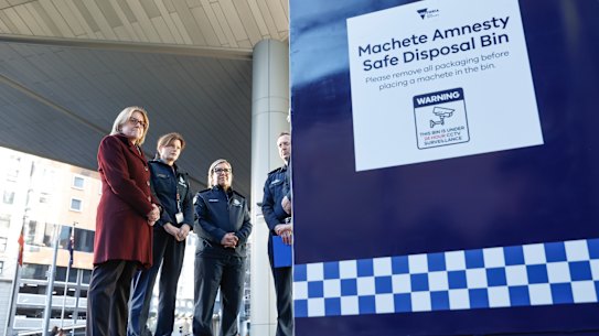 Prime Minister Jacinta Allan looks at one of the new machete amnesty boxes earlier this year.