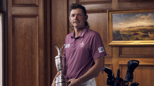 Cameron Smith with the Claret Jug in the clubhouse at St Andrews, Scotland after his 2022 victory. 
