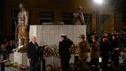 Rain stops at Anzac Day dawn service after chaplain’s prayers