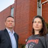 Parents James Rankin and Hannah Marshall outside Collingwood College, which has water damage on the whole top floor.