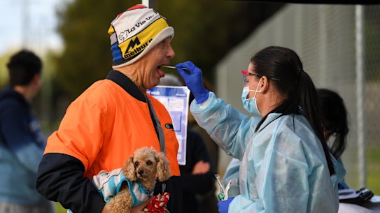A person receives a COVID-19 test at a Coronavirus pop-up testing facility in Broadmeadows, Melbourne, Friday, June 26, 2020. Coronavirus pop-up testing facilities have been setup in residential streets throughout area's considered coronavirus hotspots following a spike in cases.  (AAP Image/James Ross) NO ARCHIVING