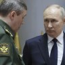 Russian President Vladimir Putin, centre, talks with Russian Chief of General Staff General Valery Gerasimov, left, and Russian Defence Minister Sergei Shoigu after a meeting with military leaders in Moscow, Russia.