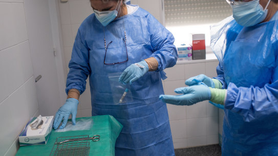 Health workers in Spain prepare to treat coronavirus patients.