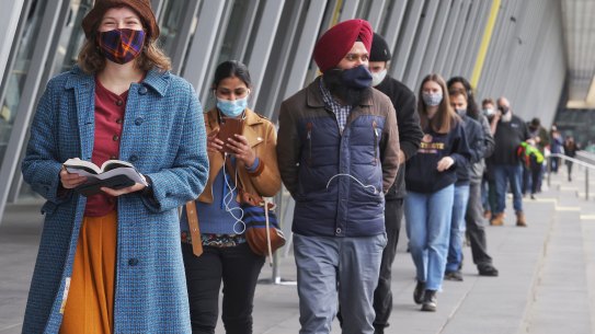 People waiting to get vaccinated at the Melbourne Convention Centre on Friday. 