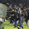 Police, officials detained as Indonesia stadium disaster toll rises
