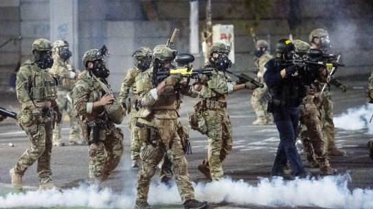 Federal agents use crowd control munitions to disperse Black Lives Matter protesters on July 2