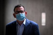 An image that is emblematic of the past 12 months: Victorian Premier Daniel Andrews wears a mask for protection against COVID19.