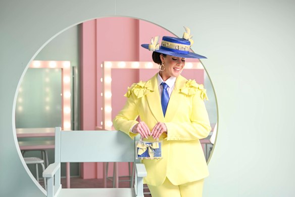 Bronwyn Lynch from Geelong in Elliatt suit and Moore Millinery Designs for Fashions on the Fields.