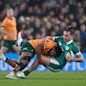 DUBLIN, IRELAND - NOVEMBER 15: James Lowe of Ireland is tackled by Filipo Daugunu of Australia during the Quilter Nations Series 2025 rugby international match between Ireland and Australia at Aviva Stadium on November 15, 2025 in Dublin, Ireland. (Photo by Charles McQuillan/Getty Images)