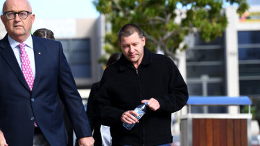 Thunder River Rapids Ride operator Peter Nemeth (right) and his lawyer Ralph Devlin QC arrive for the inquest into the Dreamworld disaster.
