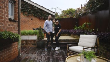 Katherine Gullotto with her husband Frank and their young son Sam in their Hurlstone Park property, which will be auctioned on Saturday.