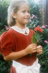 Julia aged five, wearing a velvet 
dress that was originally her mum’s. 