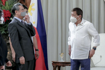 While no vaccine is authorised for general use yet in the Philippines, President Rodrigo Duterte, seen here on January 16 with China's Foreign Minister Wang Yi, has already had a jab. 