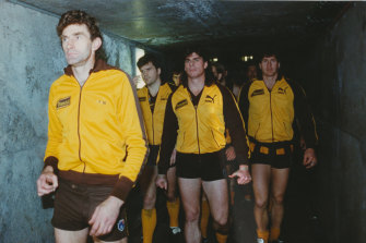 Hawthorn captain Michael Tuck leads the Hawks out for the 1991 grand final.