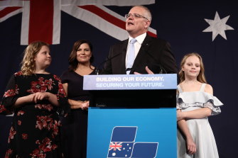 Flanked by his wife and daughters, Scott Morrison declares victory in front of the party faithful on May 18.