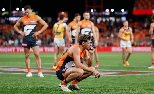 It is decision time for Giant Harry Perryman (front), and teammate Isaac Cumming (left).