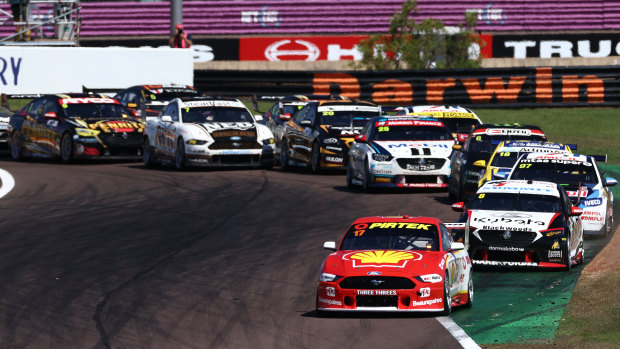 Setting the pace: Scott McLaughlin leads the field through turn one after the start of race 18.