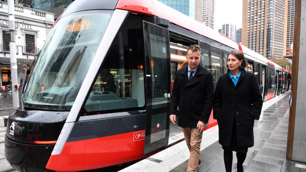 Transport Minister Andrew Constance and Premier Gladys Berejiklian inspect the first tram to reach Circular Quay, the northern end of a new light rail line from the CBD to Sydney's south east.