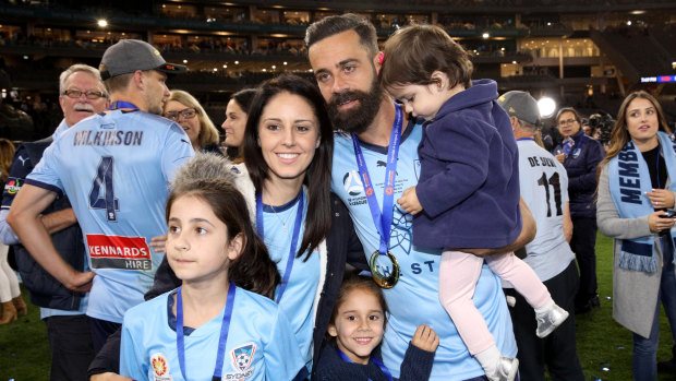 Fond farewell: Alex Brosque with his family after Sydney FC won the A-League grand final on Sunday night.