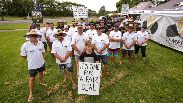 PKCT workers and their supporters outside Port Kembla Coal Terminal on Monday after being locked out by the company. 