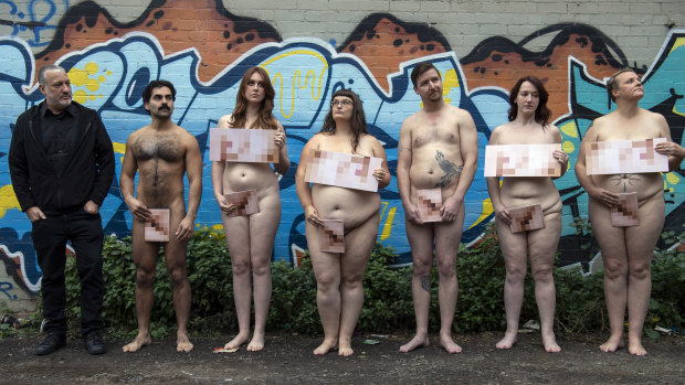 Spencer Tunick with some of the models, with pixellated 'modesty' cards, who will appear nude in this week's shoots.