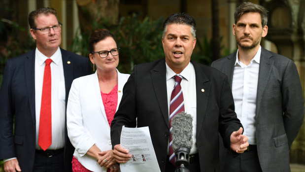 (From left) the Queensland Government Health Committee's Barry O'Rourke, Joan Pease, Aaron Harper, and Michael Berkman at a press conference at Parliament House in Brisbane on Thursday.