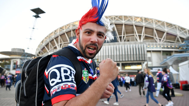 Roosters fan Toby Chich arrives at ANZ Stadium for the grand final on Sunday.