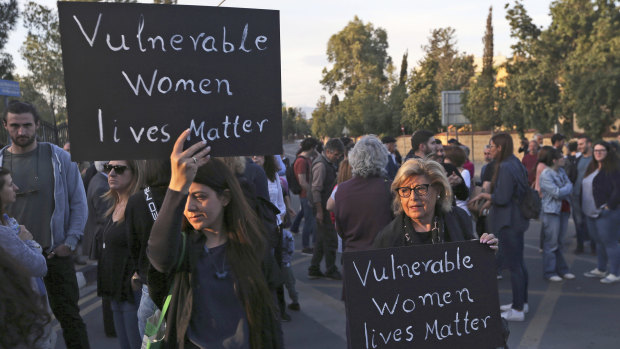 Hundreds of people turned out in front of Cyprus' presidential palace in Nicosia on Friday to remember five women and two girls that a military officer says he killed.