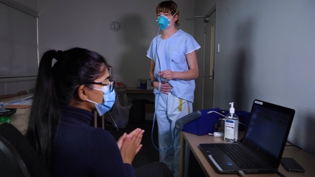 Specialist Anaesthetist Amy Lawrence (right) and testing team member Kritika Bhargava (left) during mask fit testing at Concord Repatriation General Hospital.