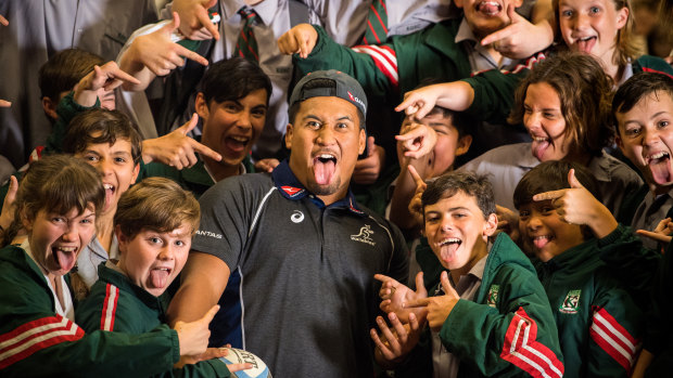 Pulling a crowd: Queensland hooker Brandon Paenga-Amosa starred when at the Wallabies team announcement at Kelvin Grove State High in Brisbane on Thursday. 