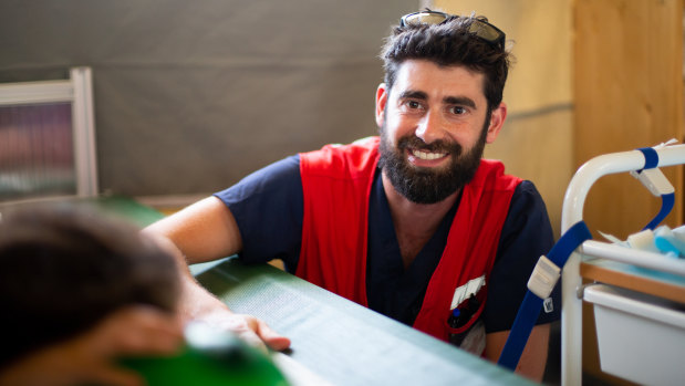 Red Cross nurse Jean-Philippe Miller treats a patient in Al-Hawl refugee camp in Syria. 